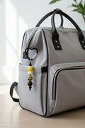 Yellow and black bee print beaded keychain with black heart carabiner clip