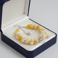 Cream rose bouquet bracelet with yellow beads and crystal flower centerpiece