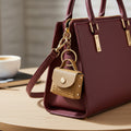Tan embossed wave vegan leather mini purse keychain with gold-tone hardware
