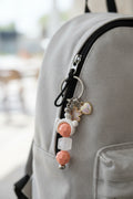 Peach teddy bear sakura heart beaded keychain with frosted cube bead and iridescent heart charm on silver hardware