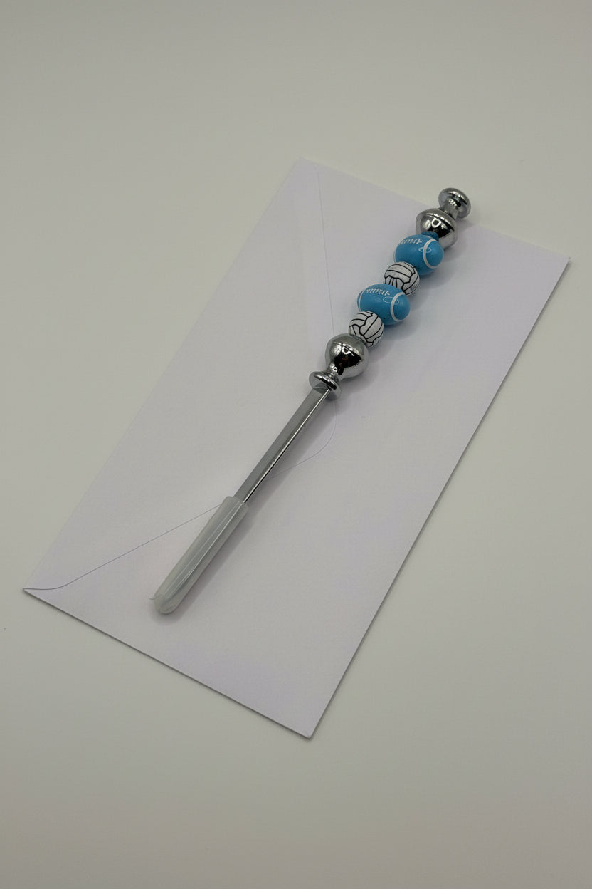 Blue football and volleyball beaded letter opener with silver metal blade
