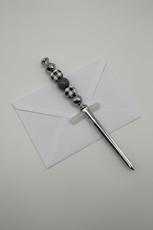 Silver letter opener with black and white buffalo plaid and gray beaded handle
