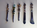 Five dark glam beaded makeup brushes with rose, heart, bow and butterfly charms on dark handles