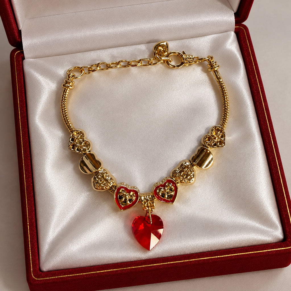 Gold red crystal heart charm bracelet with enamel heart charms and filigree beads on snake chain