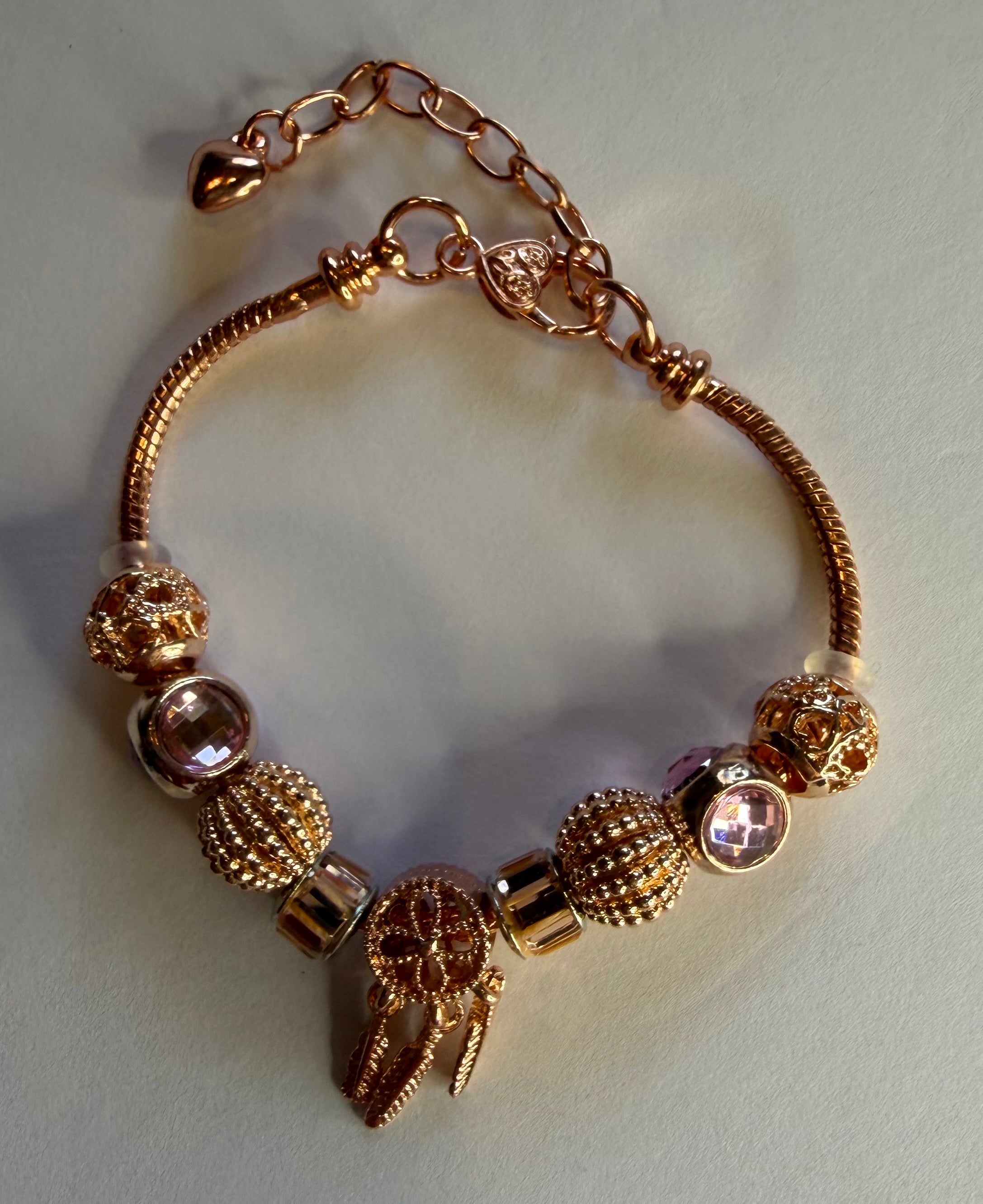 Rose gold dream catcher charm bracelet with feather drops and blush crystal beads