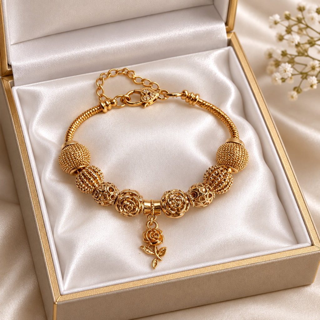 Gold rose charm bracelet with mesh ball beads and dangling rose pendant on snake chain