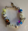 Silver multicolor dream catcher charm bracelet with angel wing charm and iridescent glass beads