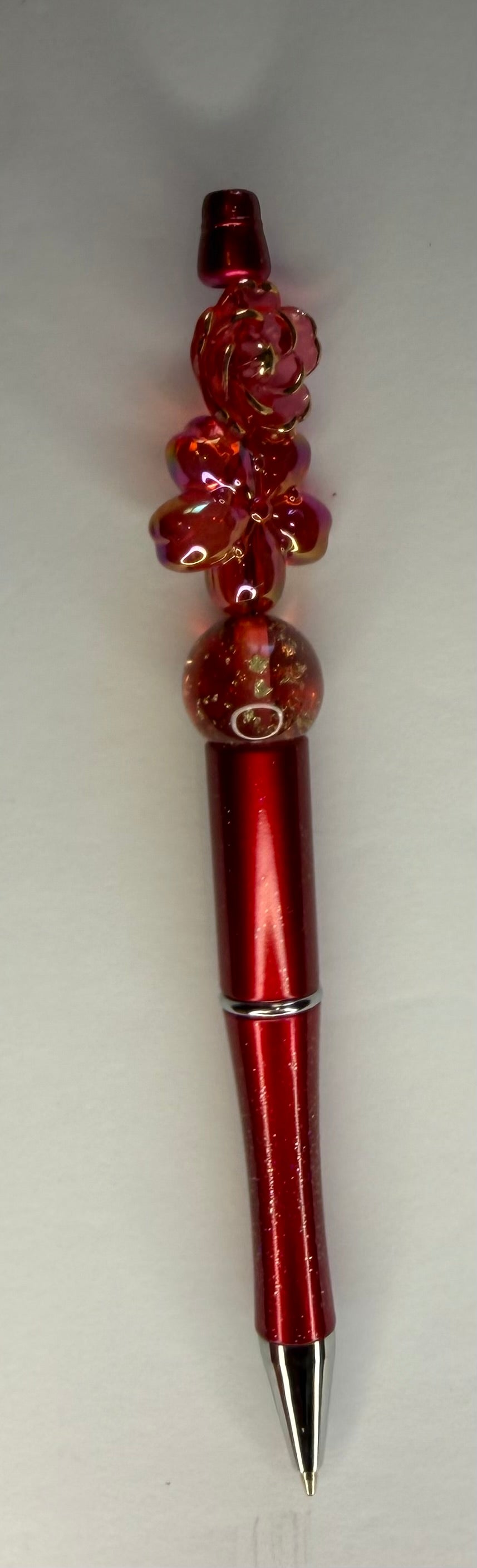 Red rose glitter beaded pen with gold-flecked globe bead and metallic red barrel