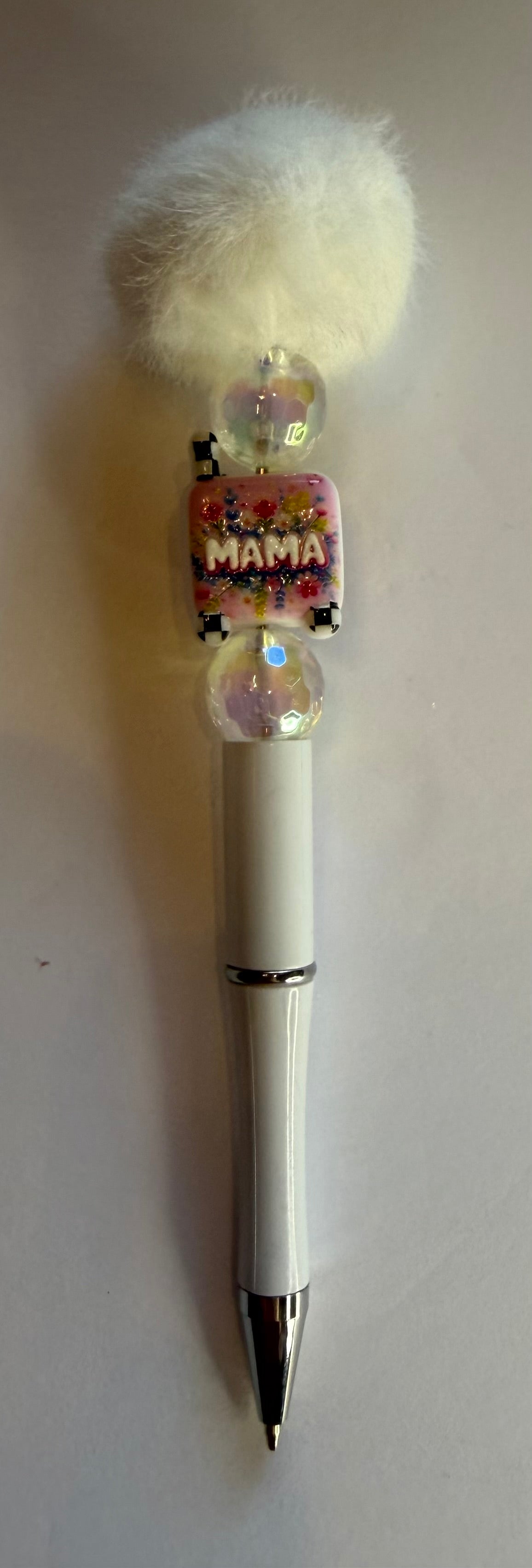 White pom pom Mama beaded pen with crystal beads and floral Mama charm on white barrel