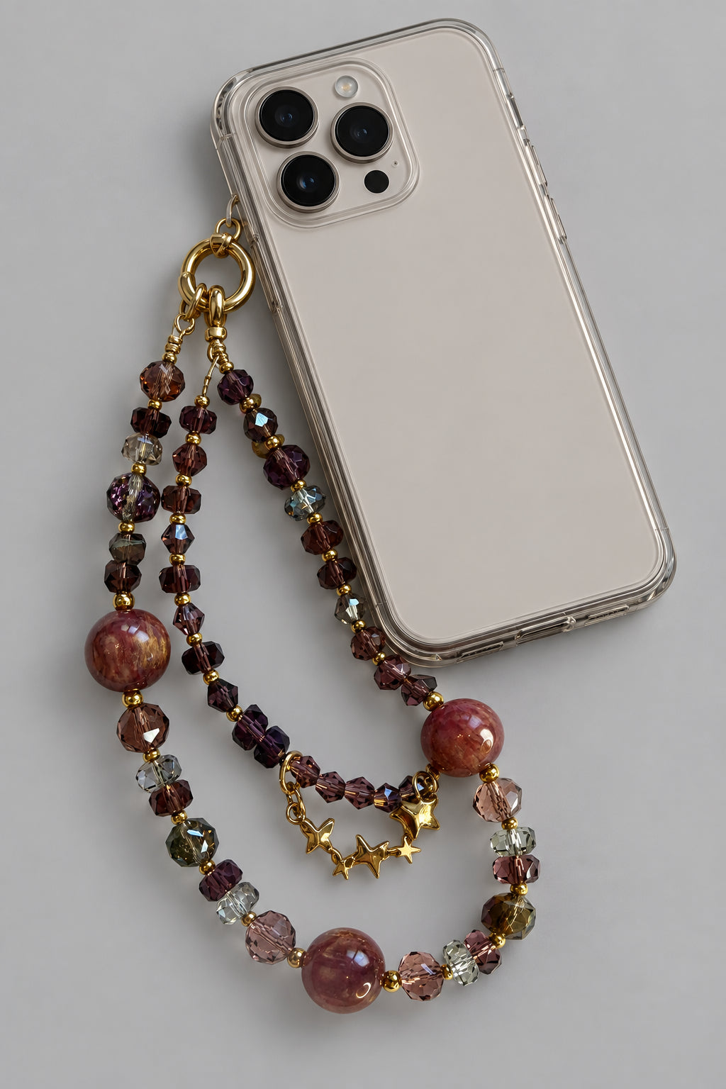 Brown marble and crystal double-strand phone wristlet with gold star beads and ring clasp