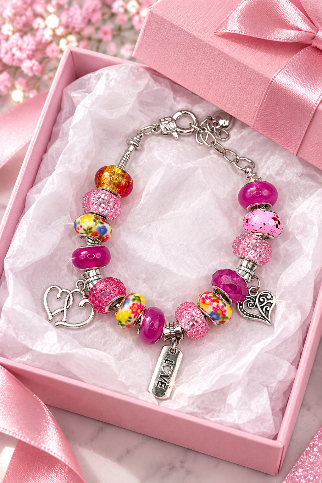 Pink Pandora-style charm bracelet with heart and LOVE charms