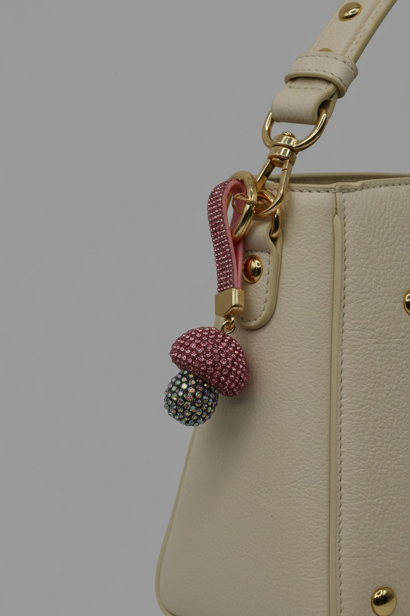 Pink rhinestone mushroom keychain with iridescent AB crystal cap and gold hardware