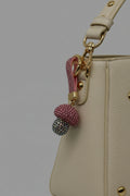 Pink rhinestone mushroom keychain with iridescent AB crystal cap and gold hardware
