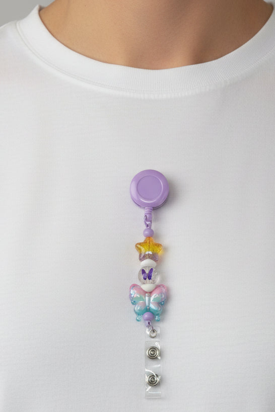Purple pastel butterfly beaded badge reel lanyard with gold star and butterfly print beads
