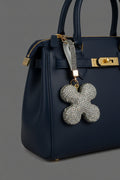 Silver AB rhinestone flower keychain with gold hardware and grey crystal strap