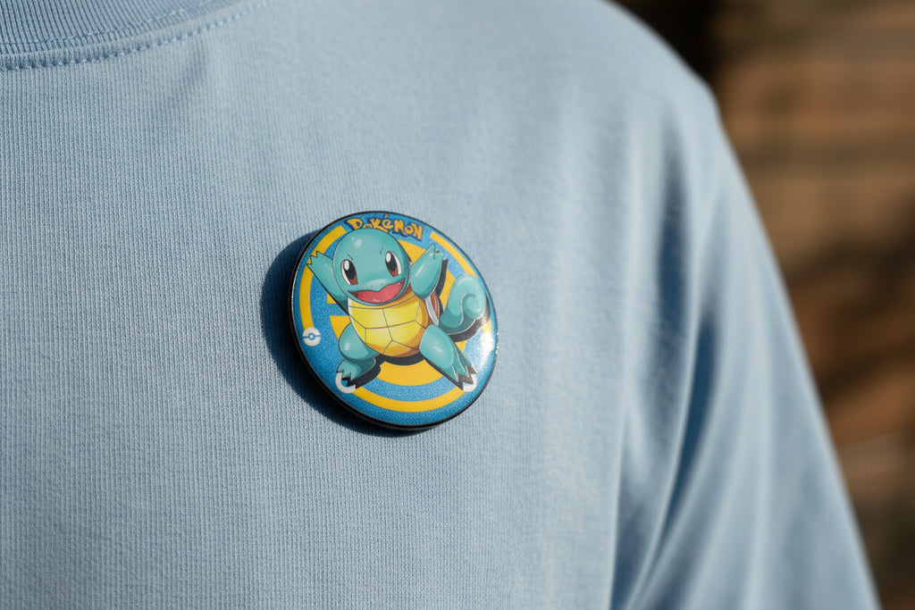 Pokémon Squirtle button pin and matching collectible card set on white background