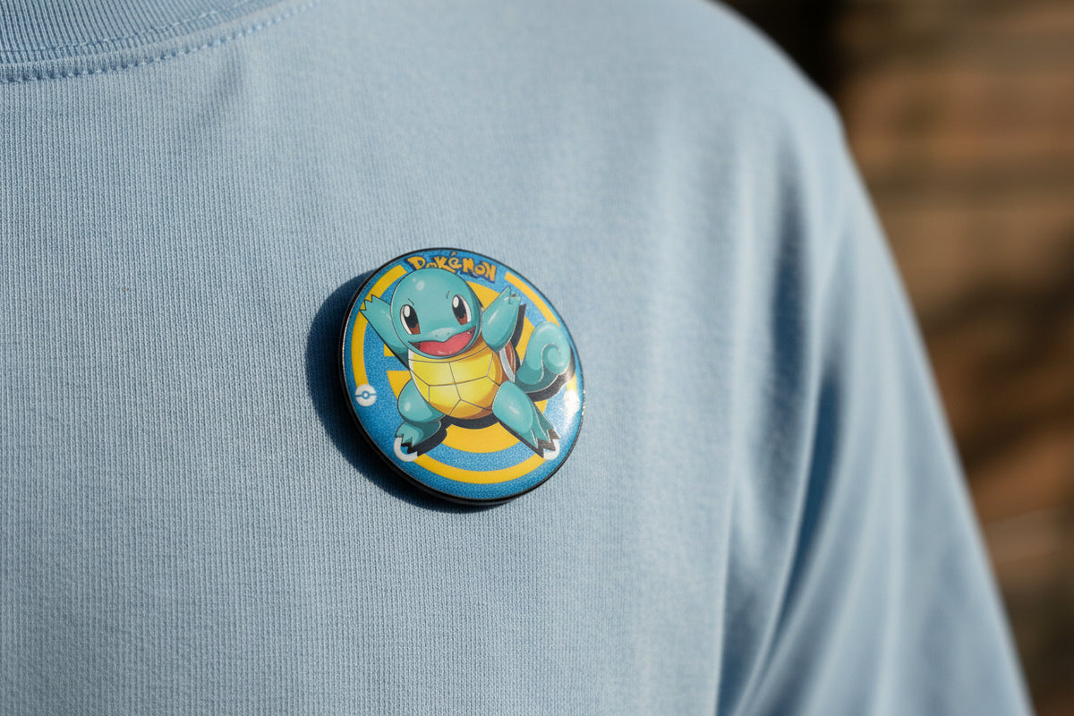 Pokémon Squirtle button pin and matching collectible card set on white background