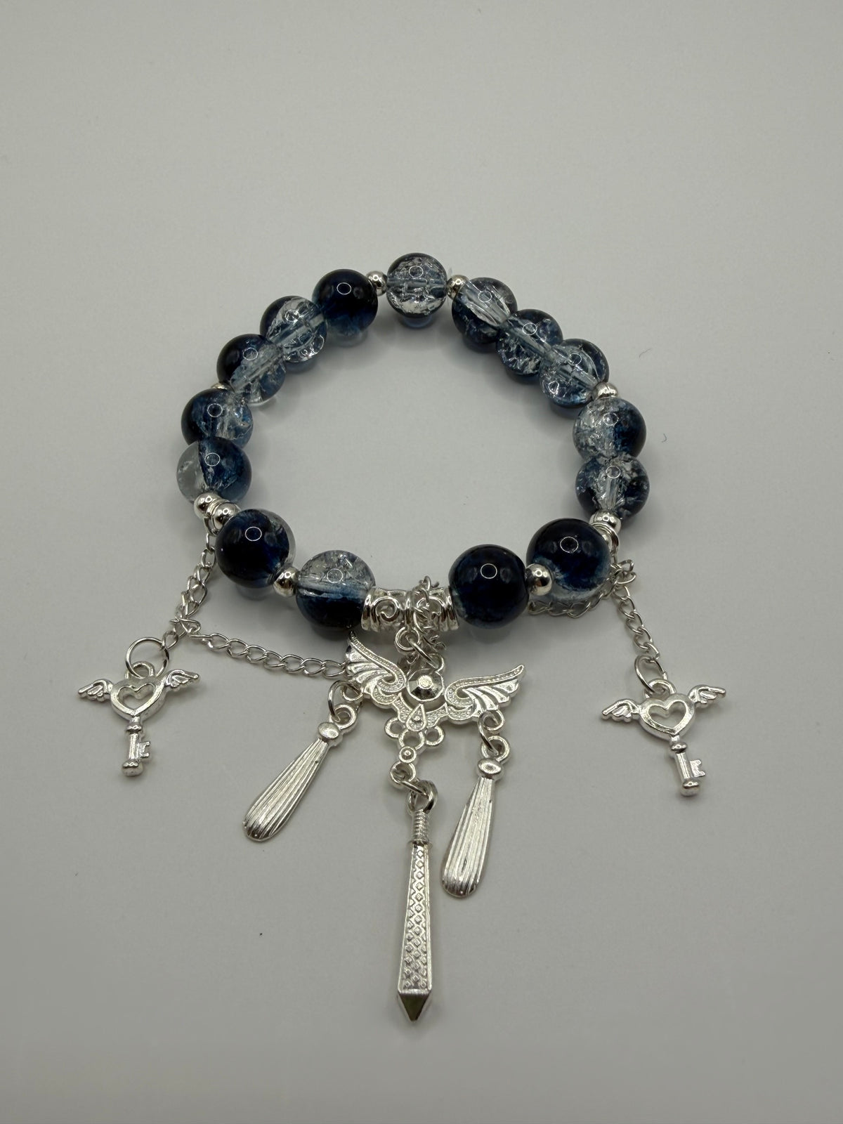 Dark Beaded Stretch Bracelet with Angel Wing & Sword Charms