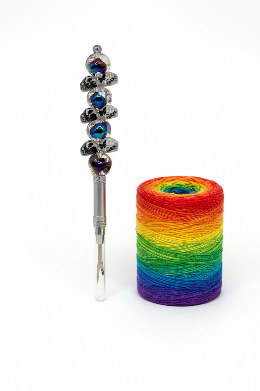 Silver seam ripper with black galaxy iridescent beaded handle
