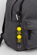 Yellow and black buffalo plaid beaded keychain with black carabiner clip