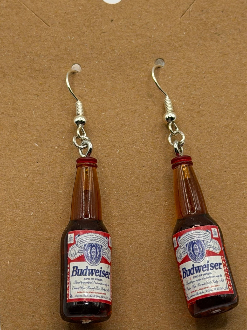Miniature Budweiser beer bottle dangle earrings with red and white label and silver fish hook backs