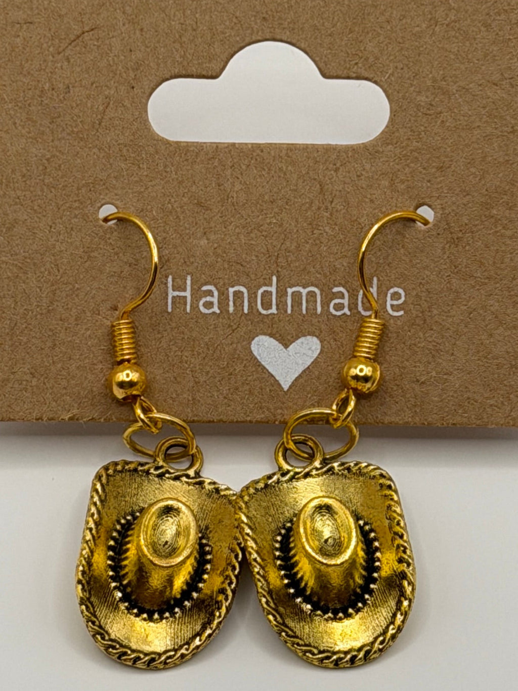 Handmade antique gold cowboy hat dangle earrings with braided rope edge detail on gold fish hook backs