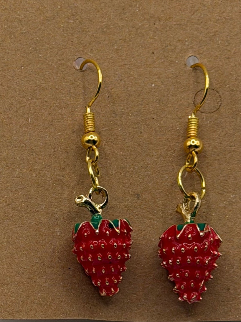 Red enamel strawberry dangle earrings with green leaf detail and gold fish hook backs