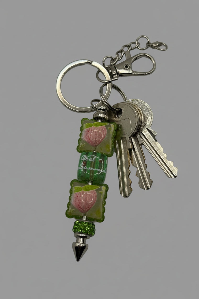 Cool Summer green floral beaded pen keychain with pink tulip beads, rhinestone spacer, and silver spike tip