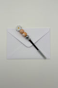 Daisy beaded letter opener with peach floral beads and daisy charm topper