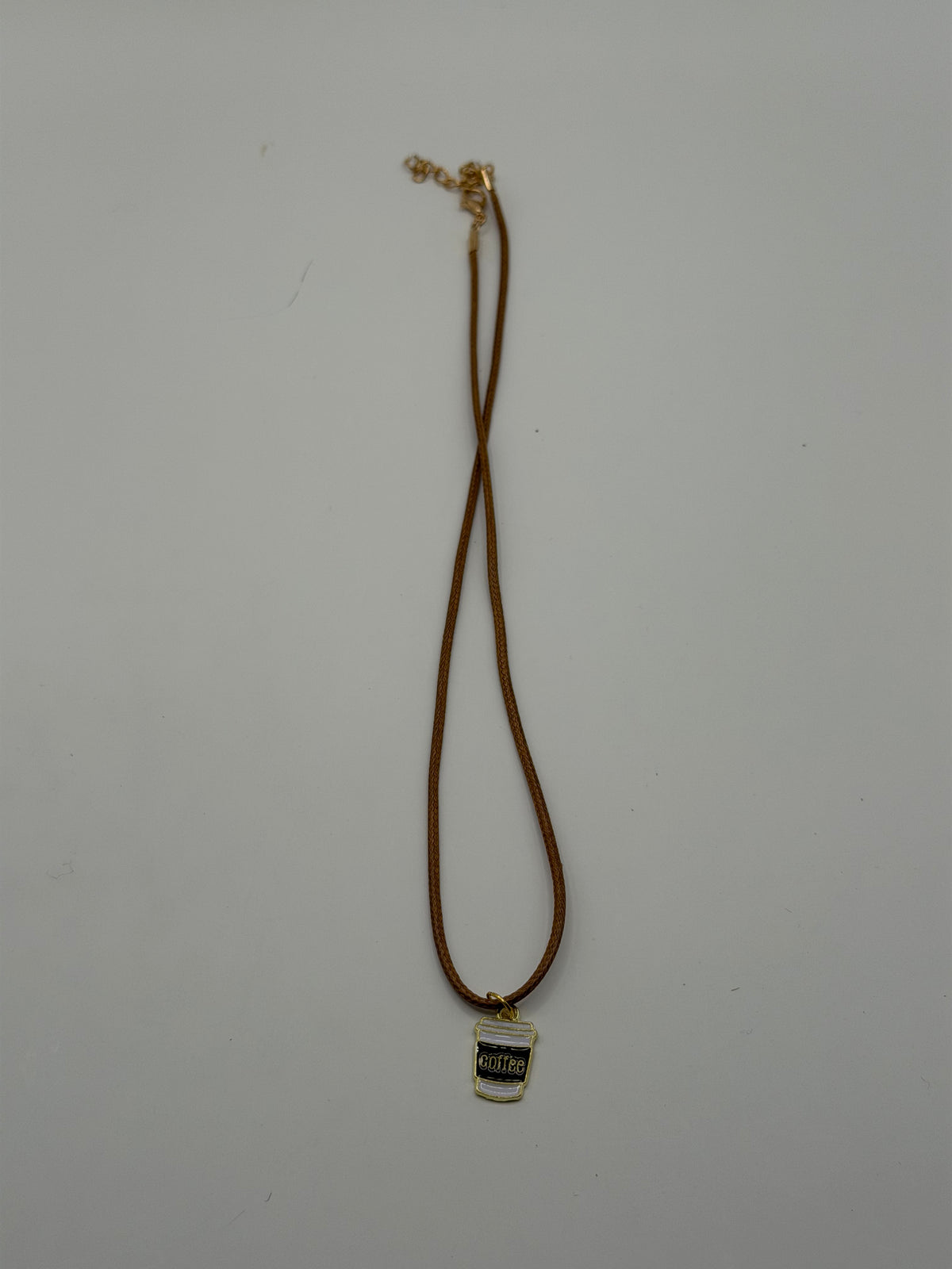 Handmade brown cord necklace with enamel coffee cup charm and gold adjustable extender chain