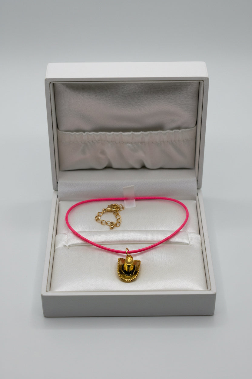 Handmade pink cord necklace with antique gold cowboy hat charm and gold lobster clasp