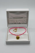 Handmade pink cord necklace with antique gold cowboy hat charm and gold lobster clasp