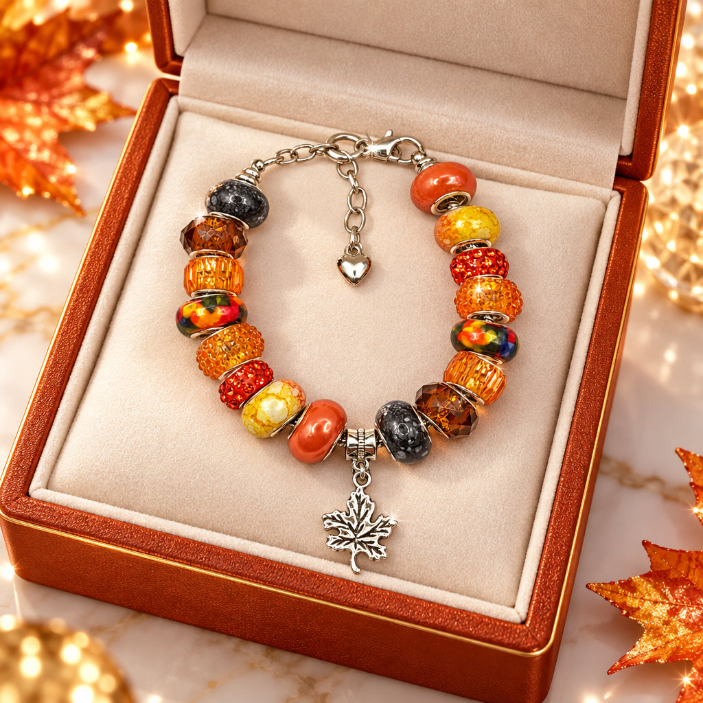 Autumn harvest Pandora-style bracelet with maple leaf charm in orange and amber tones