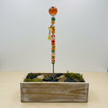 Handmade orange beaded garden wand stake with faceted amber crystal ball topper, silver maple leaf charm and yellow crystal drop