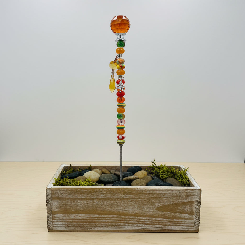 Handmade orange beaded garden wand stake with faceted amber crystal ball topper, silver maple leaf charm and yellow crystal drop