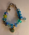 Silver ocean blue shell charm bracelet with sea turtle charm and blue crystal beads