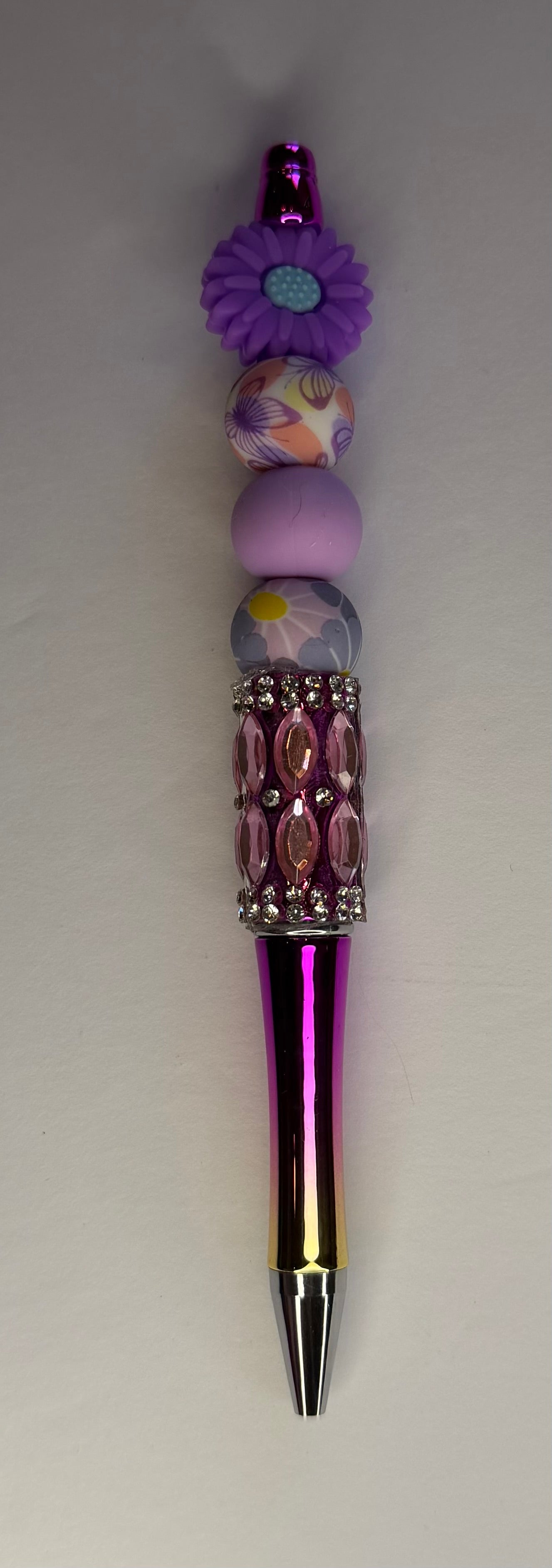 Purple daisy floral beaded pen with mauve rhinestone barrel and metallic purple body