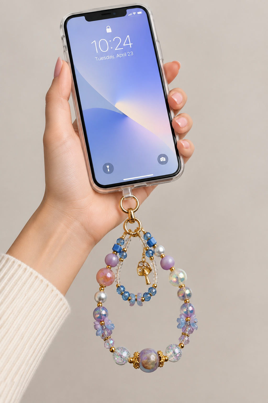 Blue purple and clear double-strand phone wristlet with lavender galaxy beads, blue crystals, flower chips, and gold mushroom charm