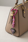 Pink heart lace bow beaded keychain with black resin heart pendant and pink heart carabiner