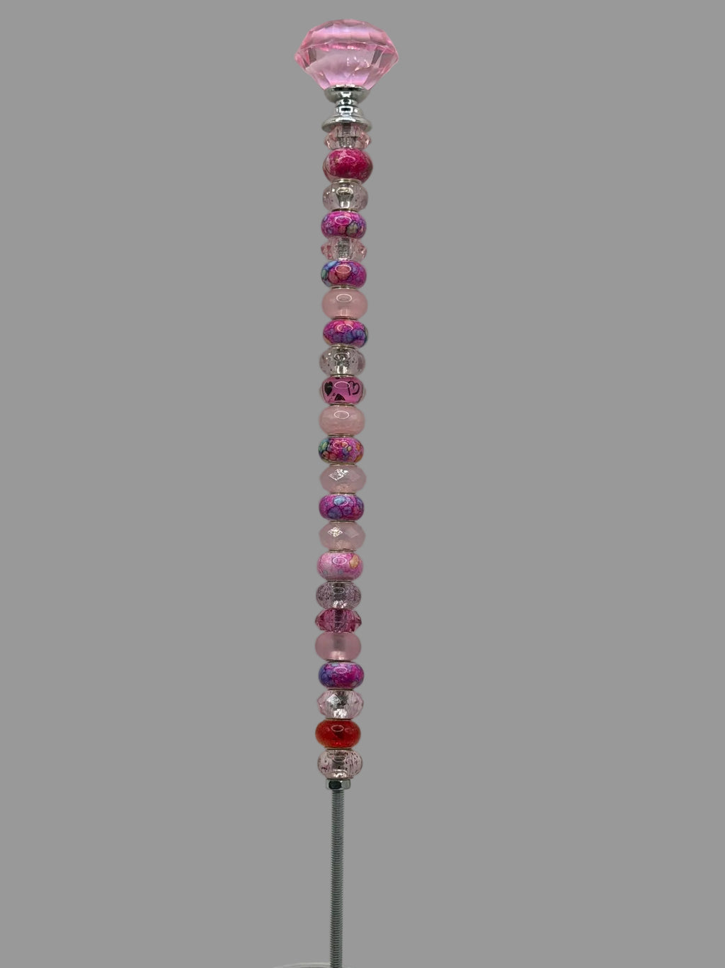 Handmade pink beaded garden wand stake with faceted pink diamond jewel topper and mix of pink, magenta and purple swirl beads