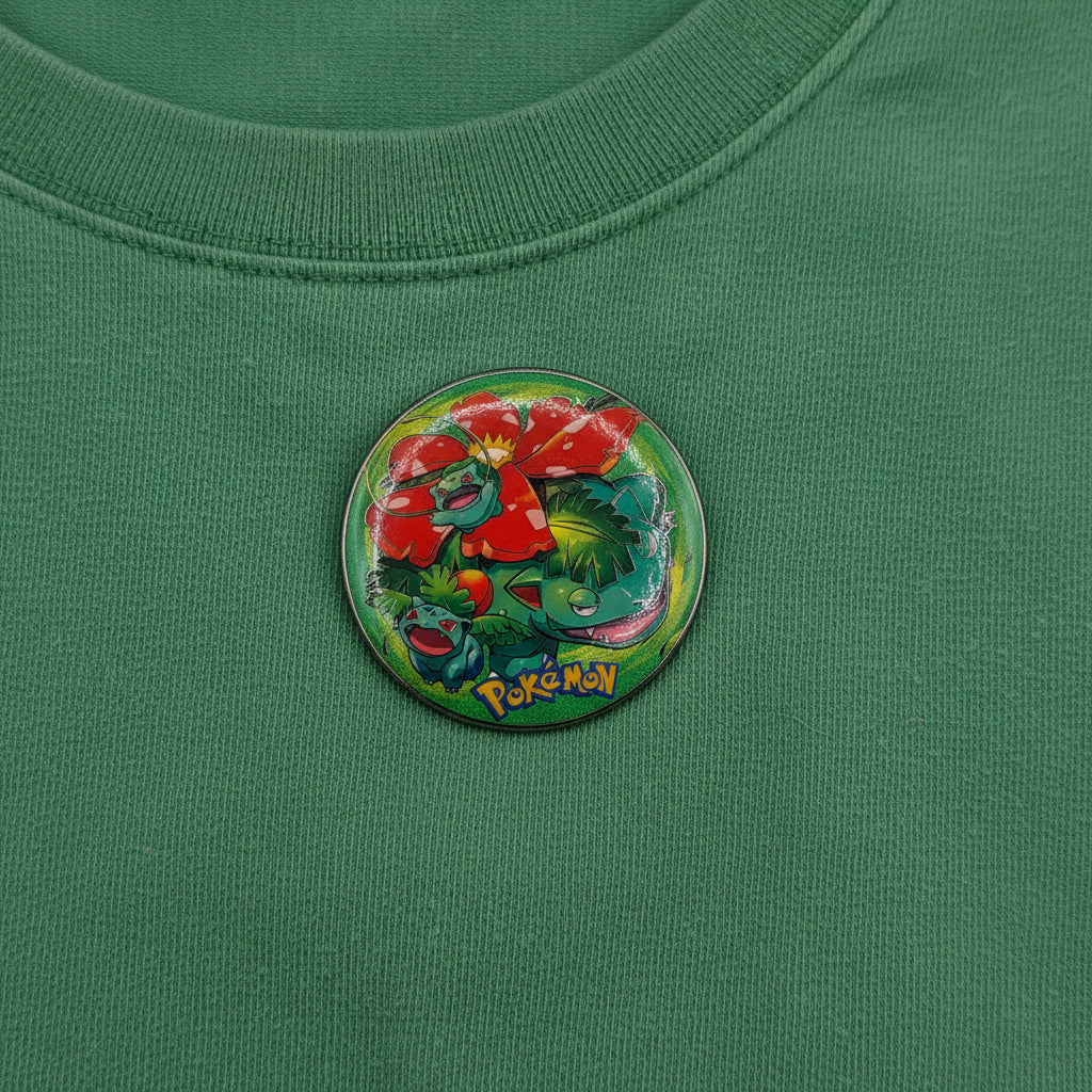 Pokémon Venusaur Ivysaur Bulbasaur button pin and matching collectible card set on white background