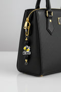 Bee-Yotch beaded keychain with black silicone beads, gold accent beads, and gold carabiner